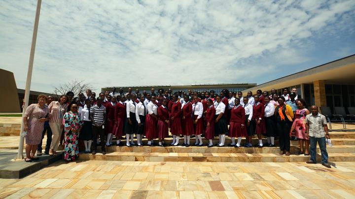 Mechanism staff at Arusha branch with school students as part of the Mentoring Programme for Arusha Girls