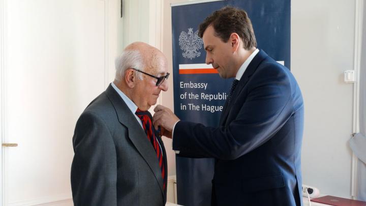 President Meron receives Award from Chargé d’affaires, Mr Piotr Kobza at the Polish Embassy in The Hague