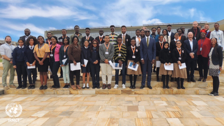 Mechanism Registrar Olufemi Elias and students from various international schools in Arusha.