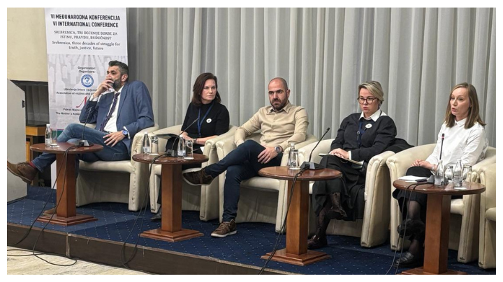 Photo depicts 5 panelists, 2 men and 3 women, sitting in armchairs on a small stage during one of the discussions at the conference
