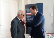 President Meron receives Award from Chargé d’affaires, Mr Piotr Kobza at the Polish Embassy in The Hague