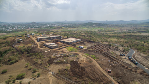 As the interior fit-out of the buildings continues, the external works are ongoing, with the installation of the perimeter fence and the construction of the parking lot and the internal road. The excavation of the underground ducting and the courtyard has also begun. 